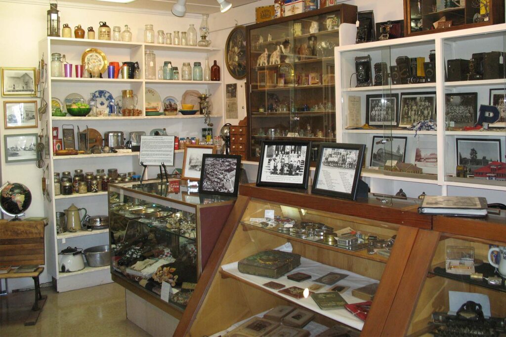 shelves with many antique objects on display at the museum